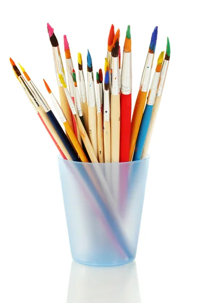 Paint brushes with gouache in cup isolated on white — Stock Photo, Image
