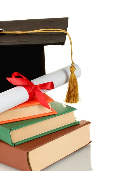 Grad hat and diploma with books isolated on white — Stock Photo, Image