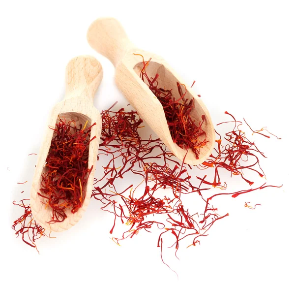 Stigmas of saffron in wooden spoons isolated on white close-up — Stock Photo, Image