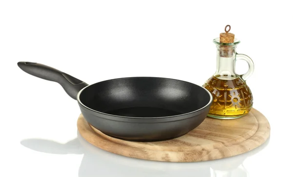 Pan with bottle of oil isolated on white — Stock Photo, Image