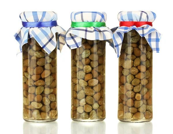 Glass jars with tinned capers isolated on white — Stock Photo, Image