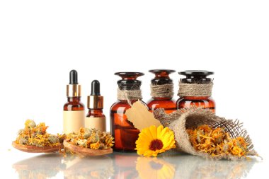 Medicine bottles and calendula, isolated on white clipart