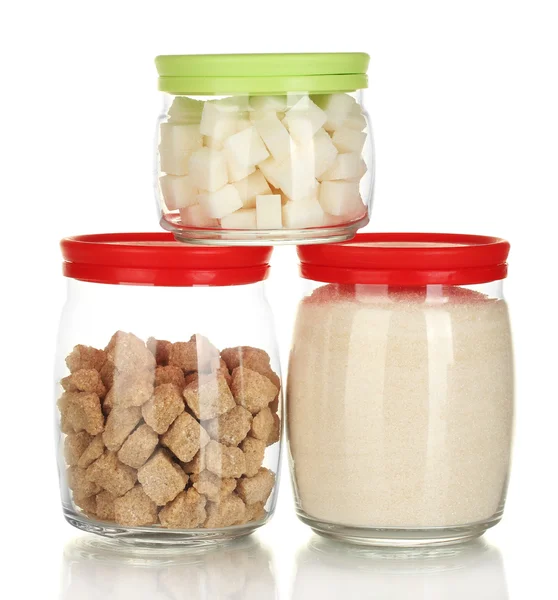 Jars with brown cane sugar lump, white crystal sugar and white lump sugar isolated on white — Stock Photo, Image