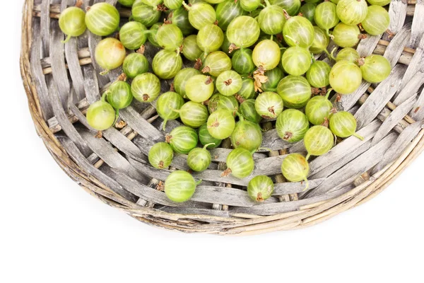 Green gooseberry on wicker mat isolated on white — Stock Photo, Image