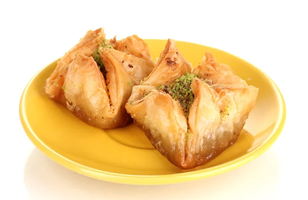 Sweet baklava on plate isolated on white — Stock Photo, Image