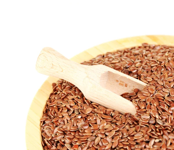 Flax seeds in wooden bowl with spoon on white background close-up — Stock Photo, Image