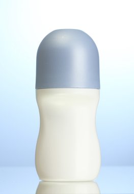 Deodorant on blue background clipart
