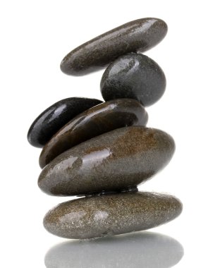 Stack of balanced stones isolated on white clipart