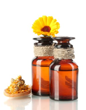 Medicine bottles and calendula, isolated on white clipart