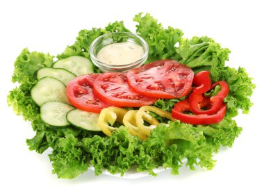 Chopped vegetables and sauce on plate isolated on white