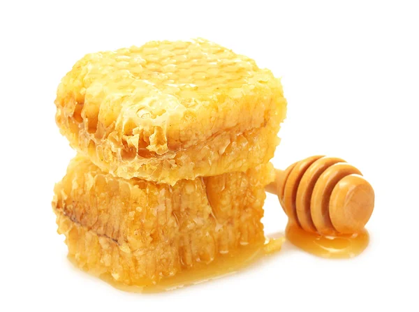 Golden honeycombs and wooden drizzler with honey isolated on white — Stock Photo, Image