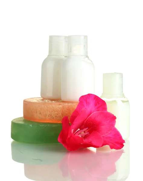 Cosmetic bottles, soap and flower, isolated on white — Stock Photo, Image