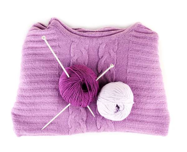 Purple sweater and a ball of wool isolated on white — Stock Photo, Image