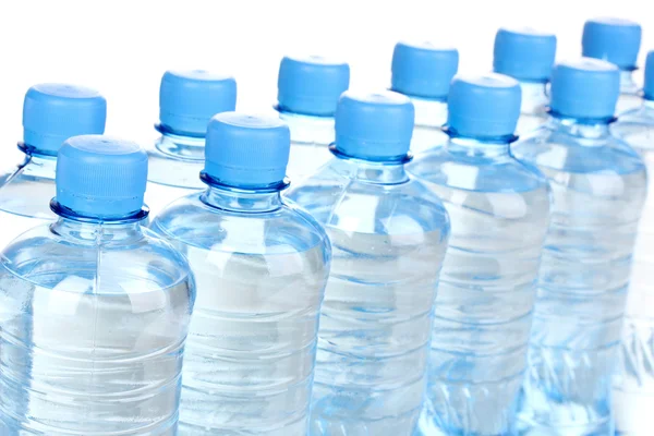 Plastic bottles of water isolated on white — Stock Photo, Image
