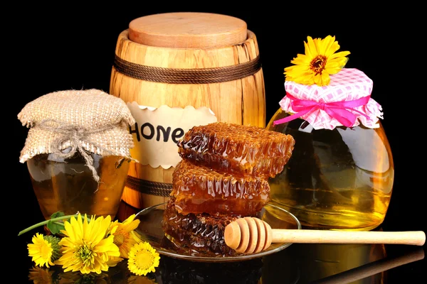 Still life of honey on black background — Stockfoto