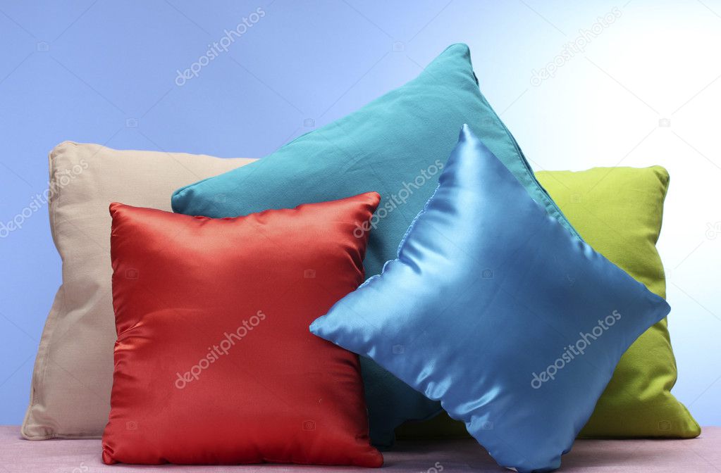 Bright pillows on blue background