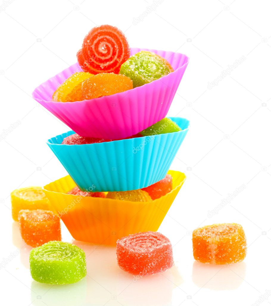 Sweet jelly candies in cup cake cases isolated on white