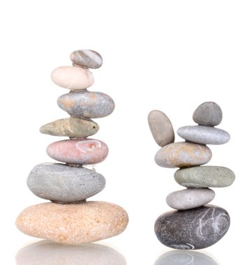 Stacks of balanced stones isolated on white clipart