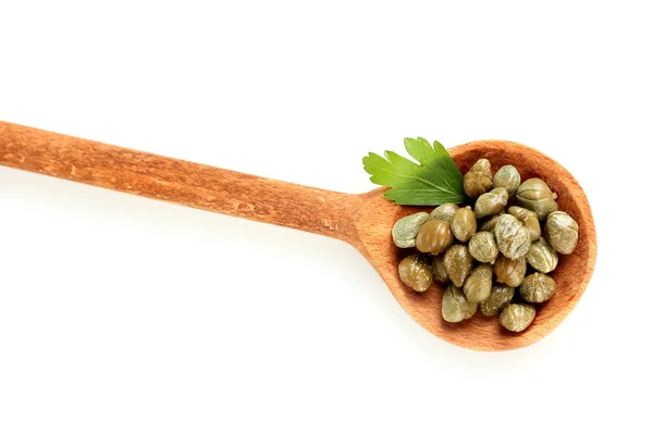 Green capers in wooden spoon on white background close-up — Stock Photo, Image