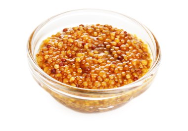 Mustard in grains in glass bowl isolated on white clipart