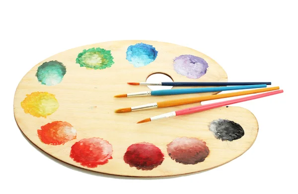 Wooden art palette with paint and brushes isolated on white — Stock Photo, Image