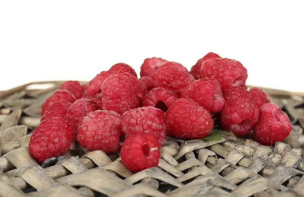 Fresh raspberries on wicker mat close-up — Stock Photo, Image