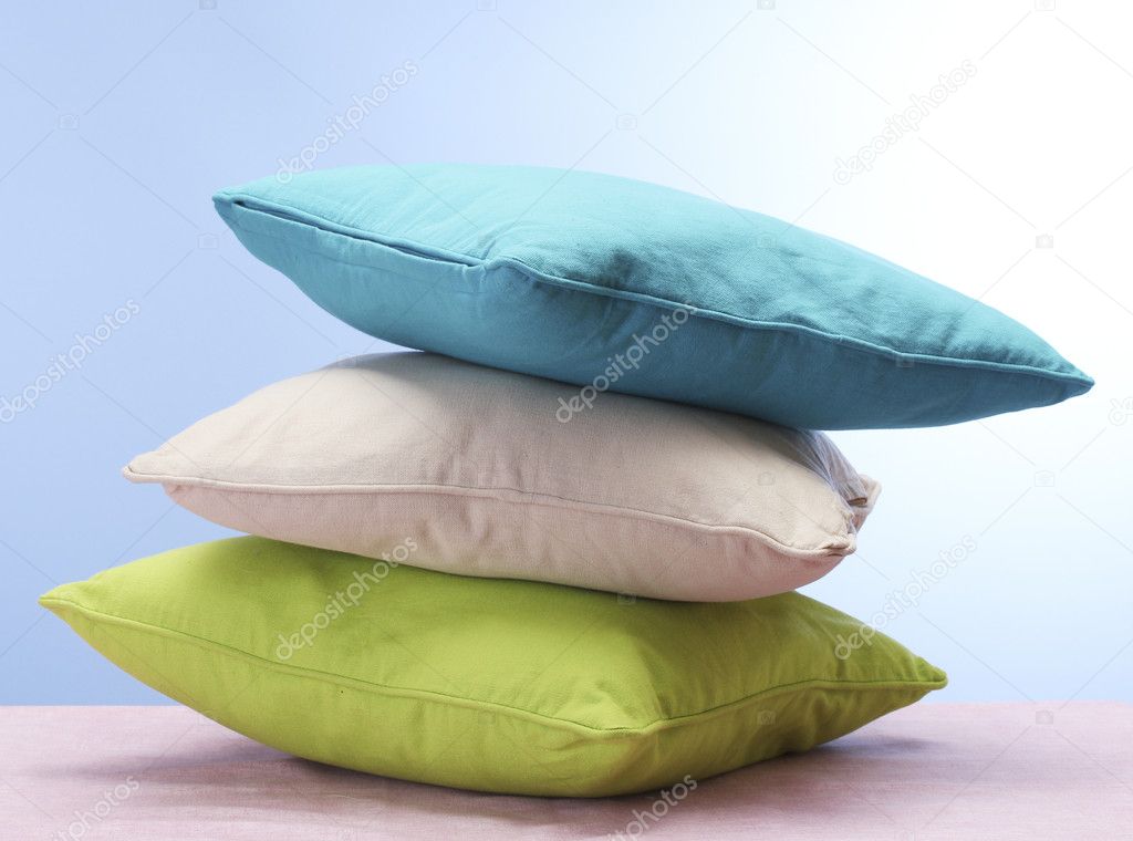 Bright pillows on blue background