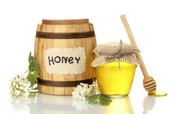 Sweet honey in barrel and jar with acacia flowers isolated on white — Stock Photo, Image