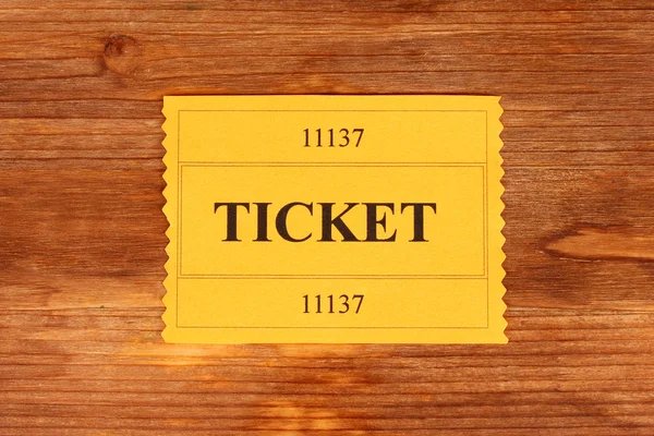 Colorful ticket on wooden background close-up — Stock Photo, Image