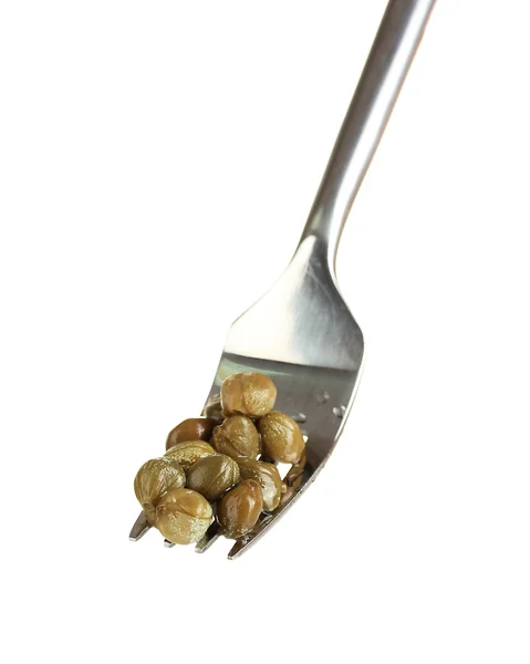 Green capers in metal fork on white background close-up — Stock Photo, Image
