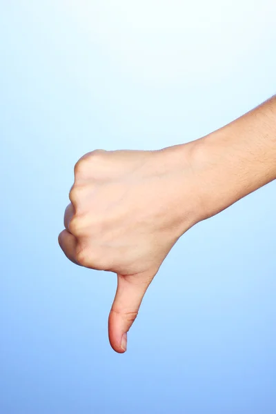 Hand making sign on blue background — Stock Photo, Image