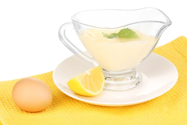 Mayonnaise in bowl on napkin isolated on white — Stock Photo, Image