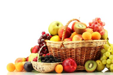 Assortment of exotic fruits and berries in baskets isolated on white clipart