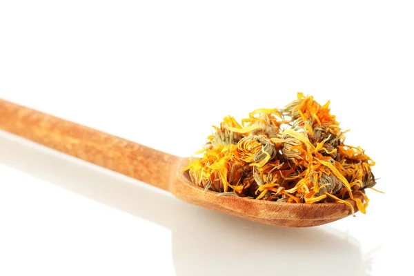 stock image Dried calendula flowers in wooden spoon, isolated on white