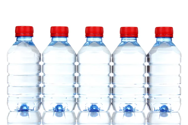 stock image Plastic bottles of water isolated on white