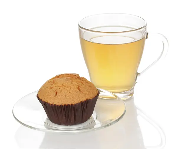 Stock image Fresh muffin with tea isolated on white