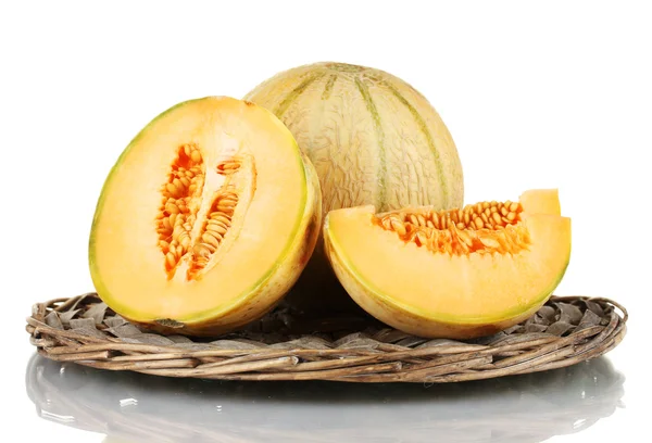 Cut melon on wicker mat isolated on white — Stock Photo, Image