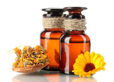 Medicine bottles and calendula, isolated on white clipart