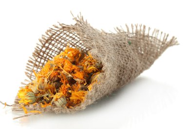 Dried calendula flowers in sacking, isolated on white clipart