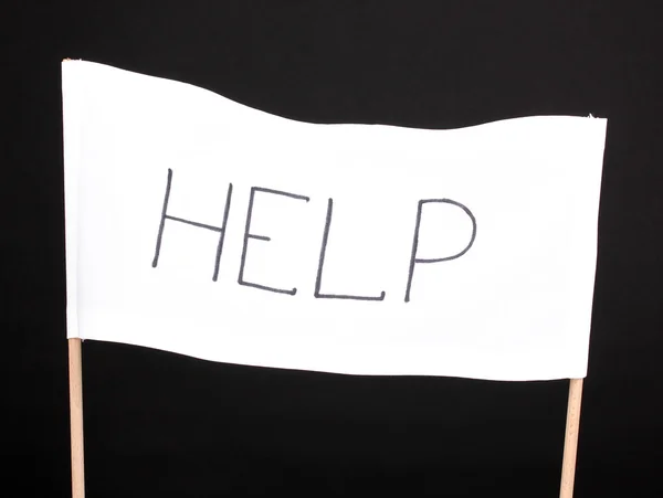 Ayuda escrita en tela blanca aislada en negro — Foto de Stock