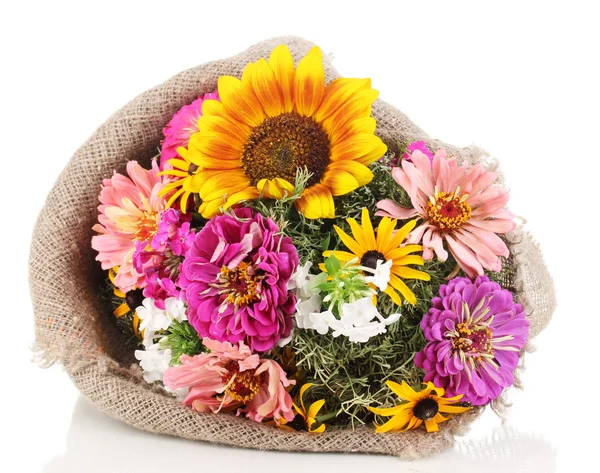 Beautiful bouquet of bright flowers in sacking isolated on white — Stock Photo, Image