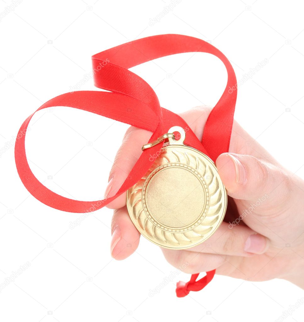 Gold medal in hand isolated on white