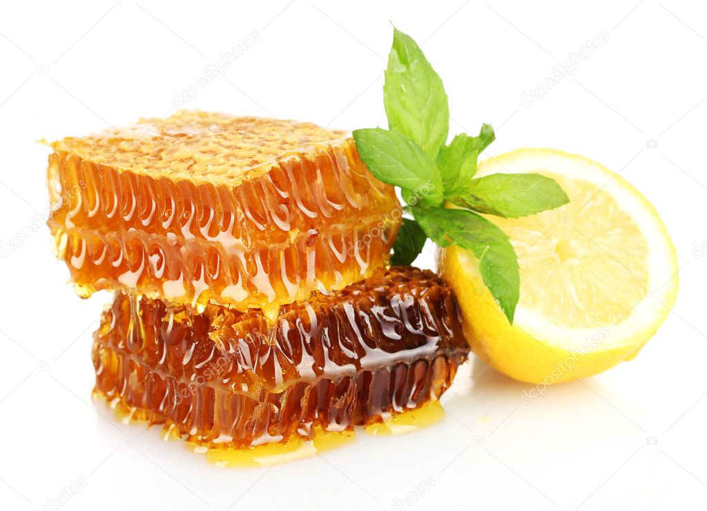 Sweet honeycombs with lemon and mint, isolated on white