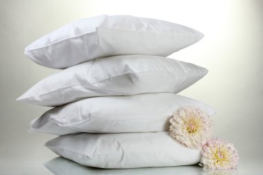 Pillows and flowers, on grey background clipart