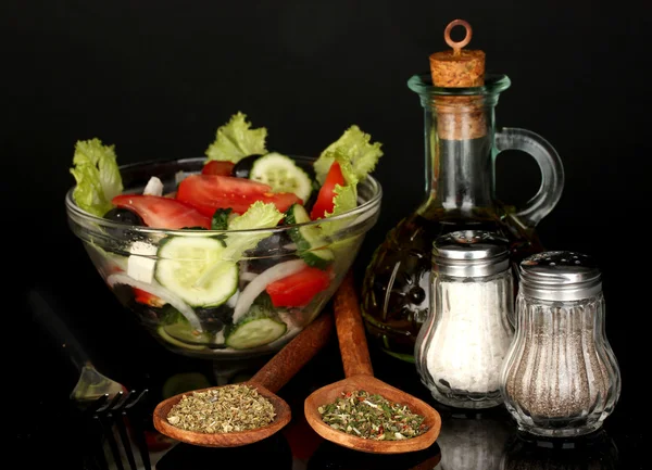 Tasty greek salad isolated on black — Stock Photo, Image