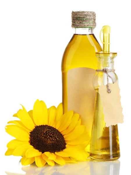 Oil in jars and sunflower, isolated on white — Stock Photo, Image