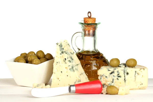 Composition of blue cheese and olives in a bowl on grey background close-up — Stock Photo, Image