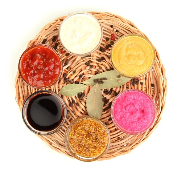 Various sauces on wicker mat — Stock Photo, Image