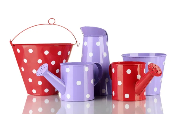 Purple and red watering cans and buckets with white polka-dot isolated on white — Stock Photo, Image