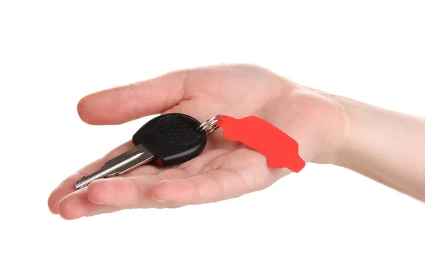 Bilnyckel med charm i hand isolerad på vit — Stockfoto